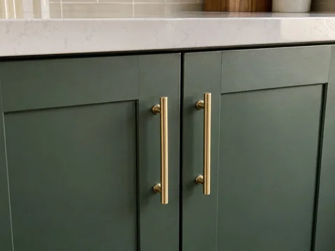 Sample completion photo of cabinet joinery and brass hardware